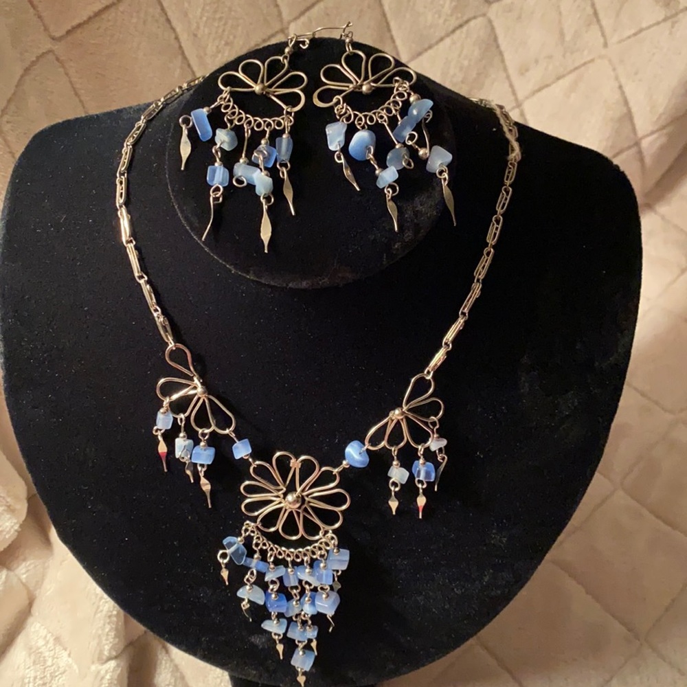 Handmade alpacas over and iridescent blue necklace